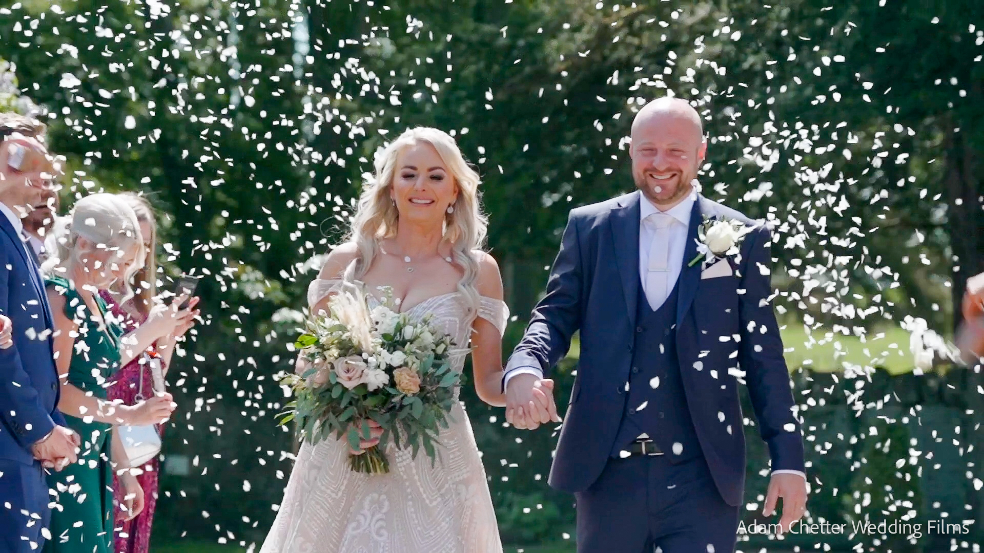 Bride and Groom Showered with Confetti at Woodhill Hall