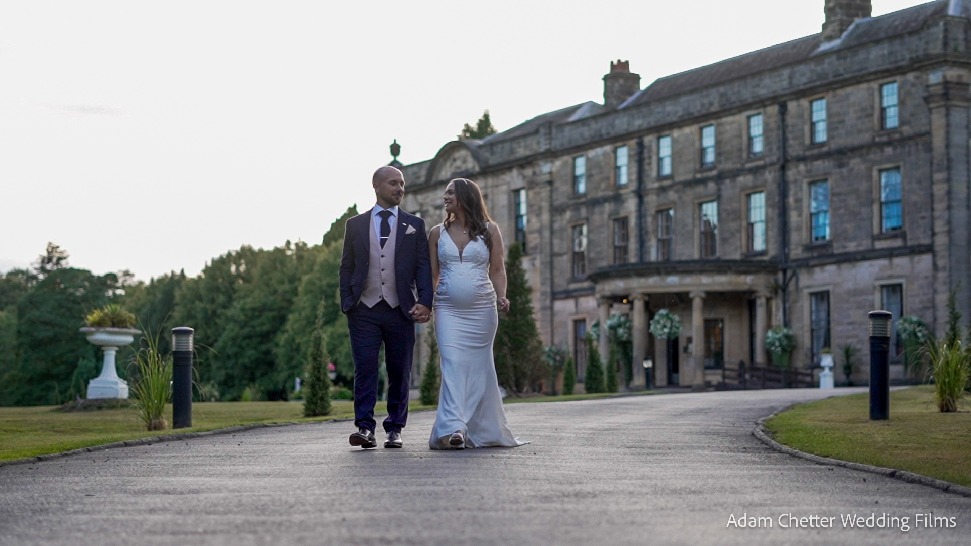 Bride and Groom Walking In Front Of Beamish Hall