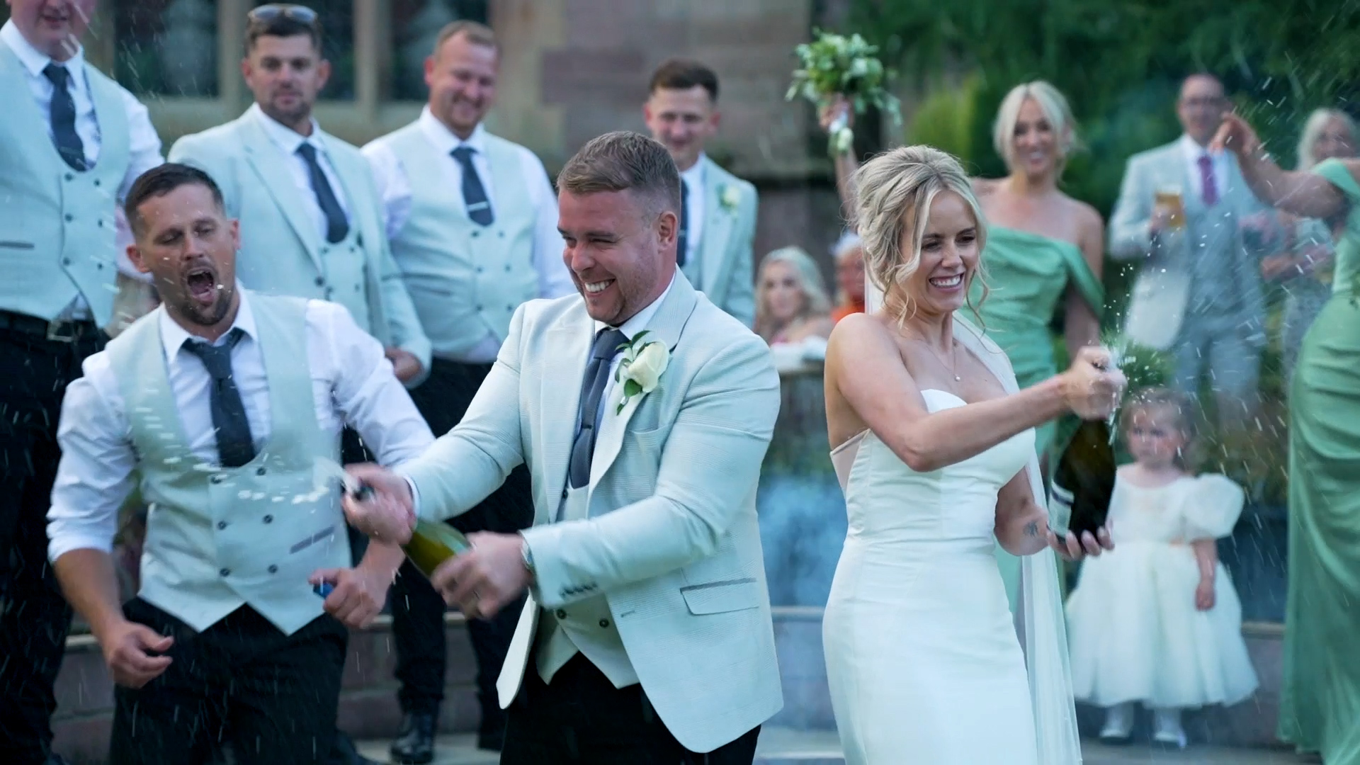 Michael and Toni Popping Champaign On Wedding Day