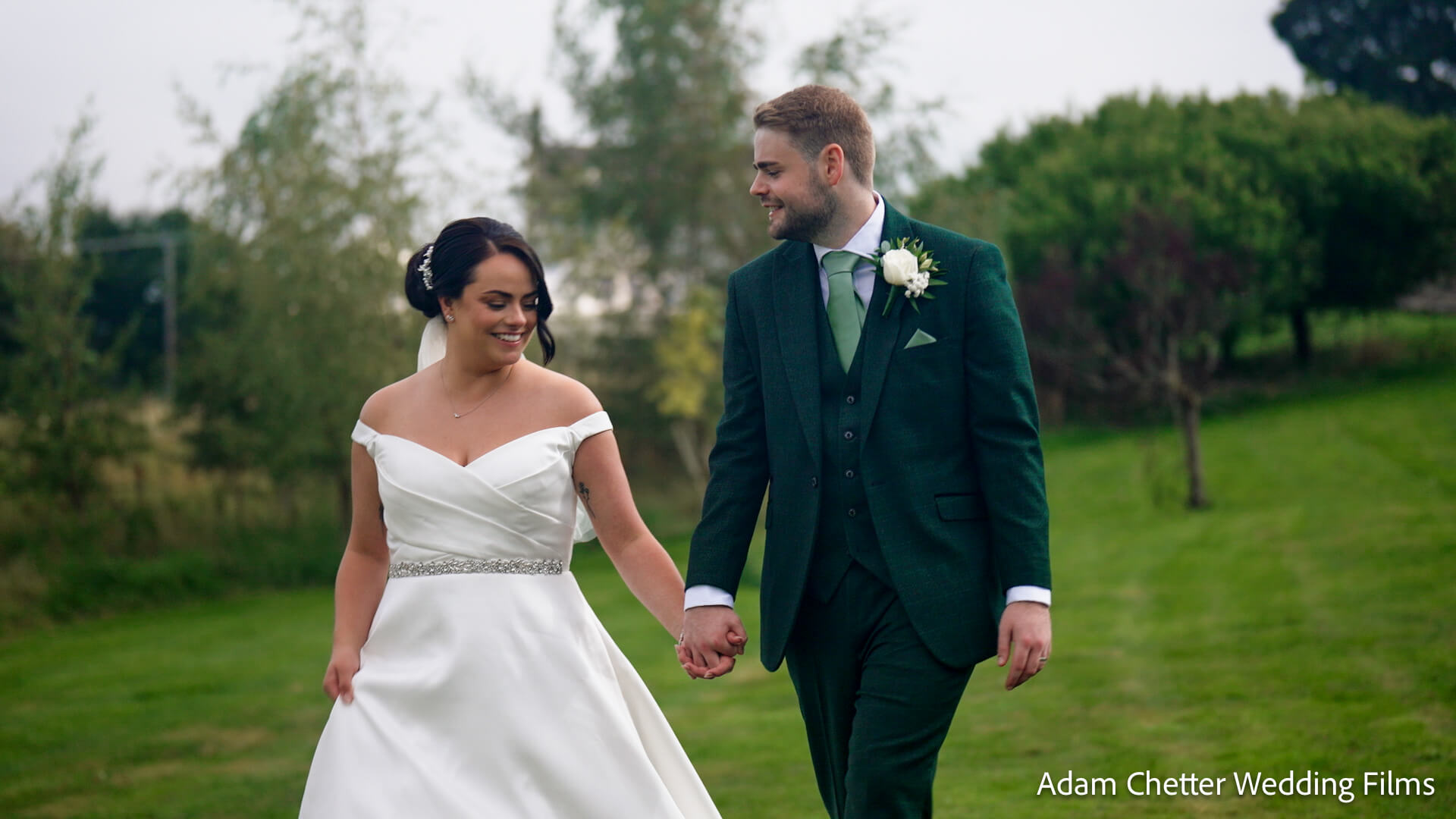 Bride and Groom Walking At South Causey Inn Field