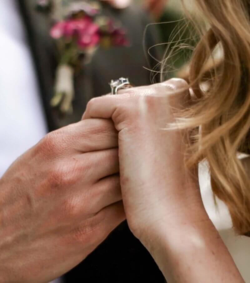 Bride and Groom Hold Hands